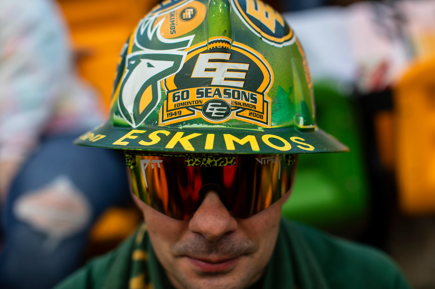 An Edmonton Elks fan wearing a hat with the team's old name.