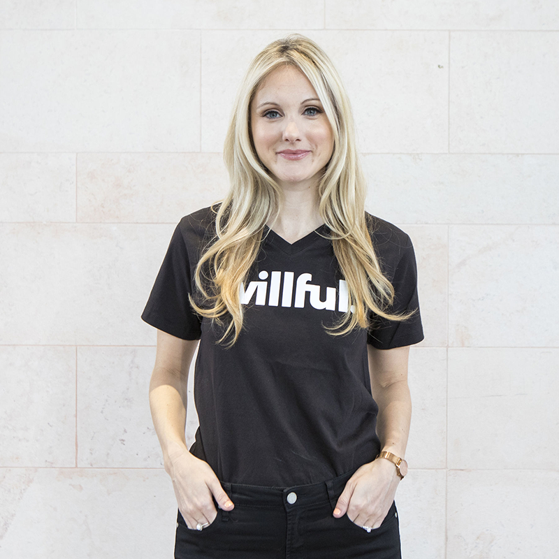 Willful CEO Erin Bury posing in a black Willful t-shirt