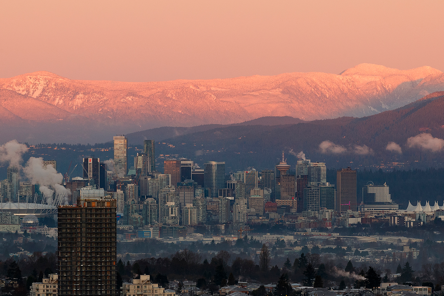 A photo of downtown Vancouver and mountain scape