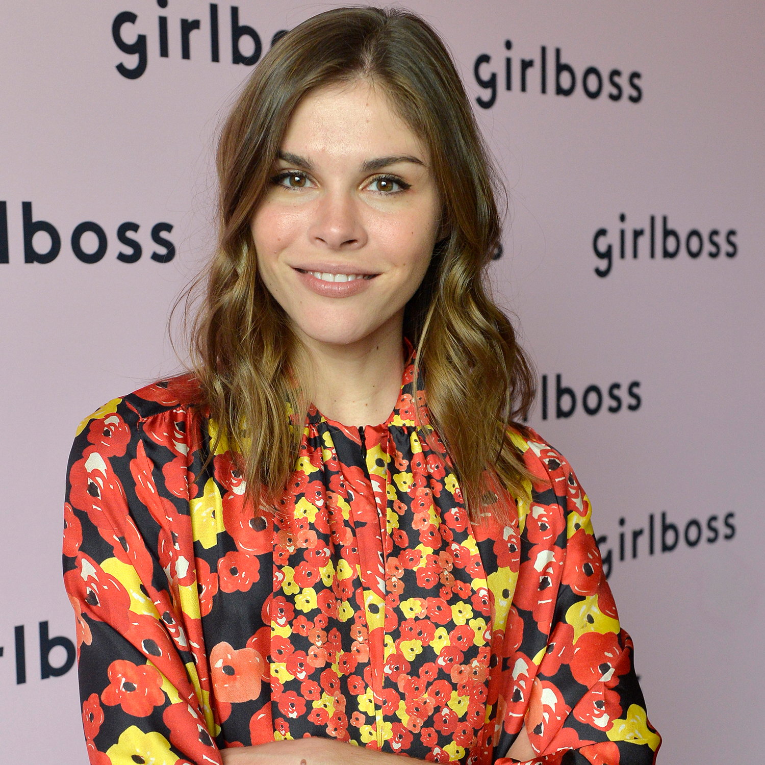 Emily Weiss, CEO of Glossier, posing at a Girlboss event