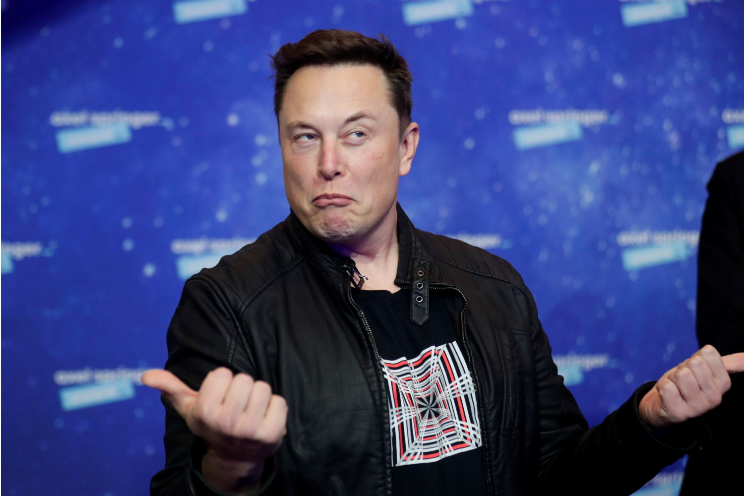 Tech layoffs: A photo of Elon Musk in a black jacket