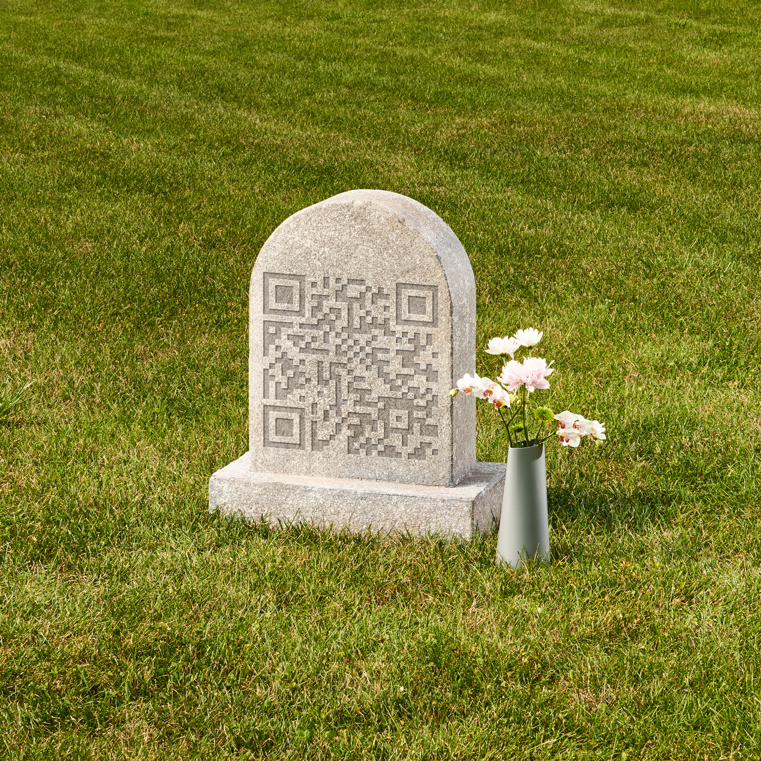 A photo of a tombstone in a grassy patch of lawn representing funeral start-ups
