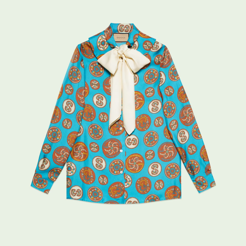 A photo of a blue Gucci blouse 