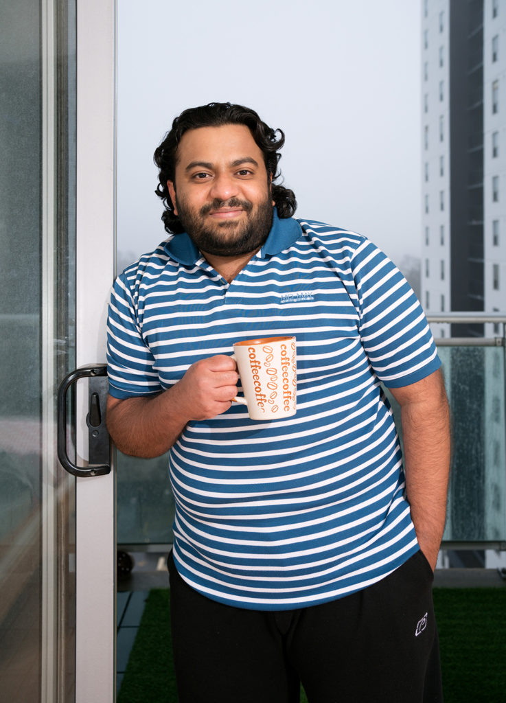 Sidharth Iyer holding a coffee cup