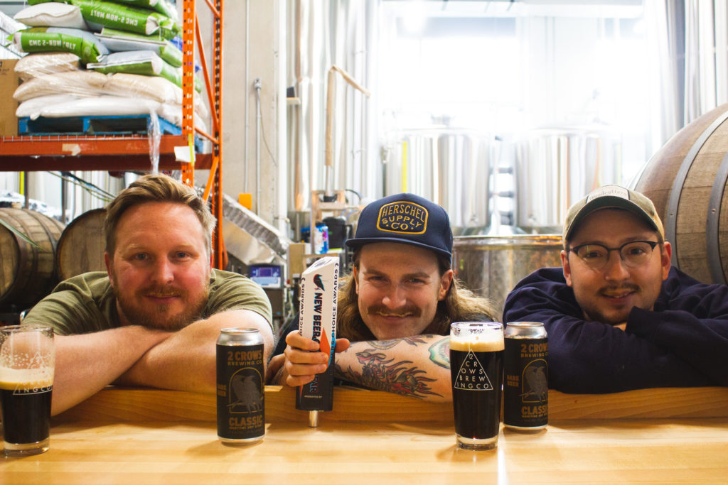 Taylor, Gallagher and lead brewer Miles Bishop pose with their award-winning beer, the Classic Maritime Dry Stout, after it was recently crowned ‘Best New Beer’ by Brewers Journal Canada