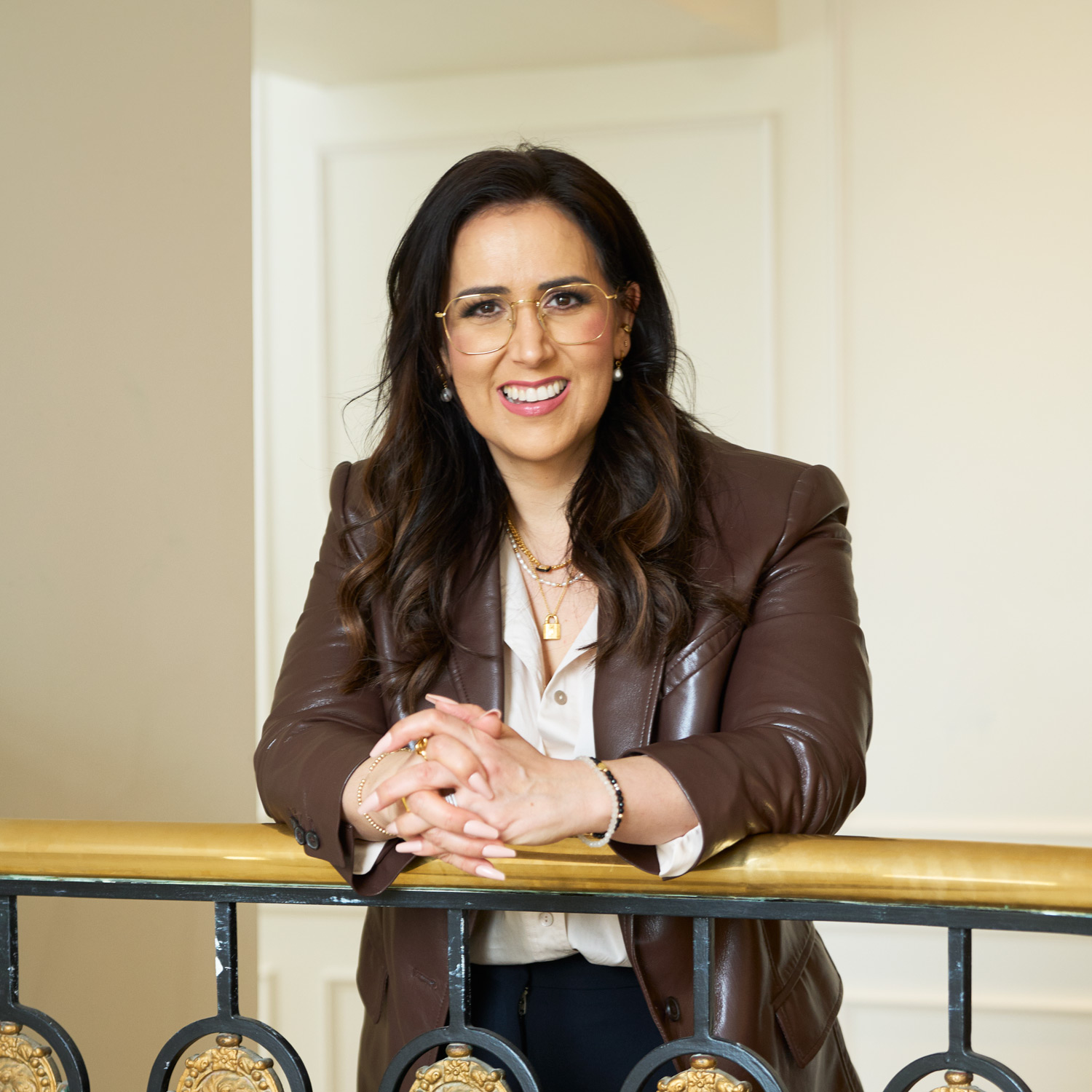 Carinne Chambers-Saini, co-founder of Diva, posing in a brown jacket