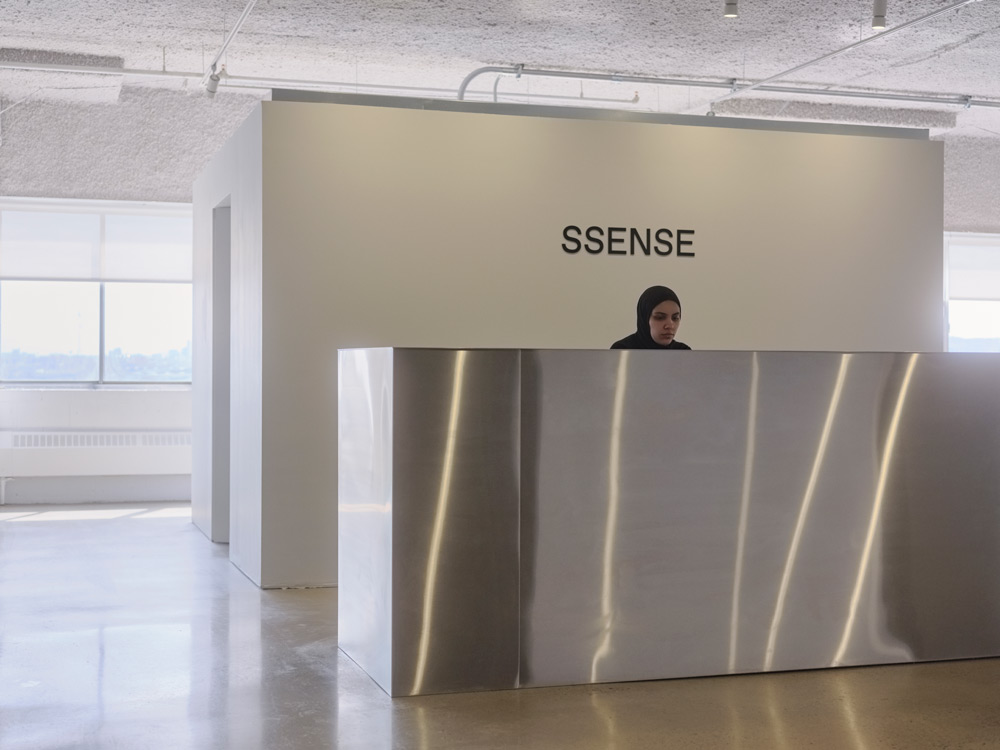 The lobby of e-commerce retailer SSENSE with a human behind the front desk