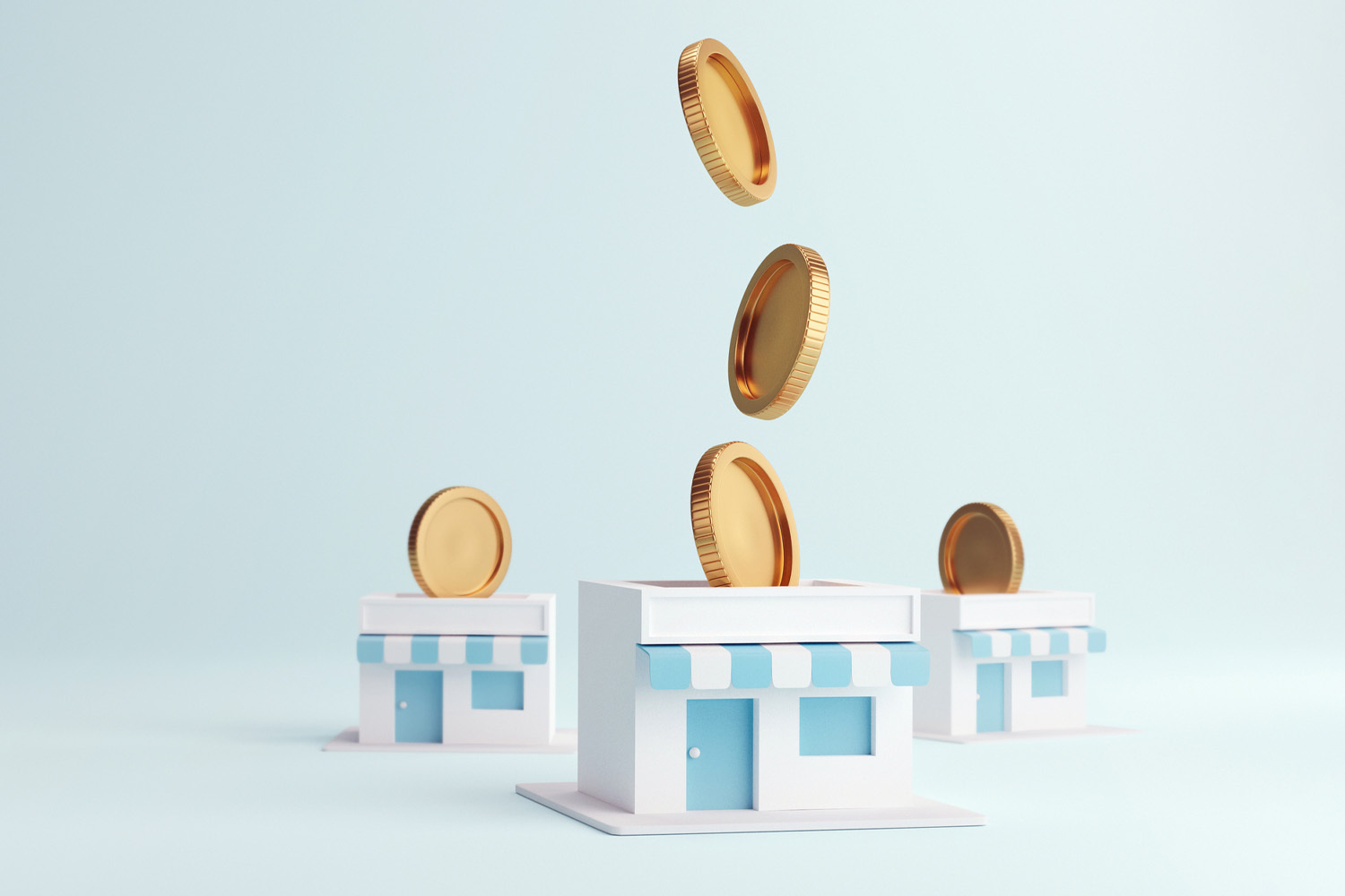 Small model houses with coins dropping into them