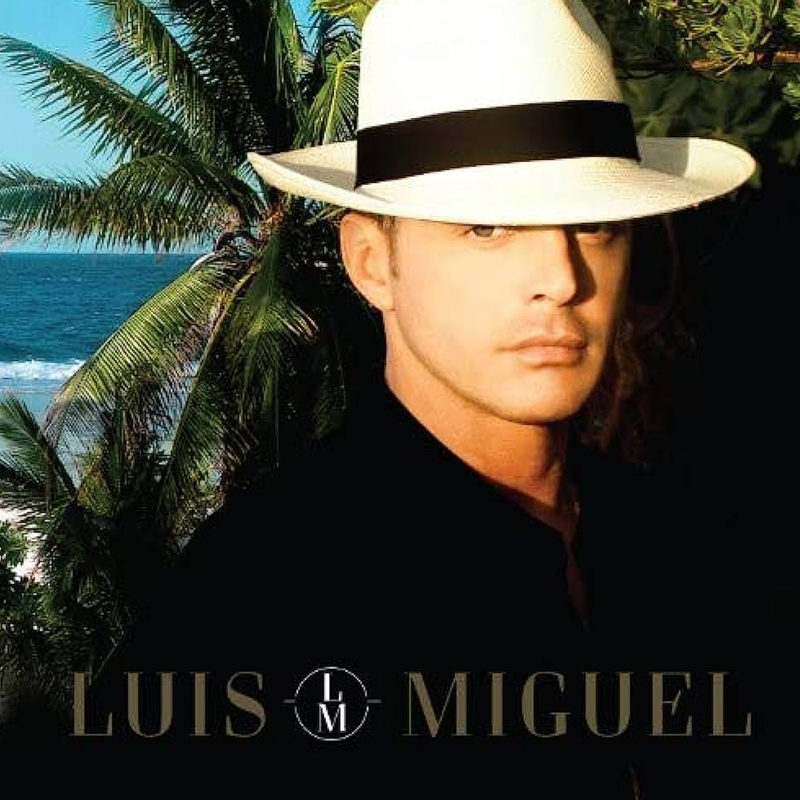 The cover of a Luis Miguel album with Luis Miguel wearing a fedora 