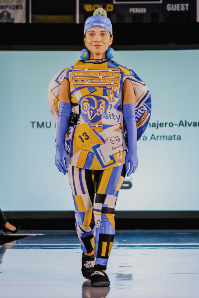 A model on the catwalk of the TMU fashion show wearing one of the designs made from old Ryerson-branded clothing