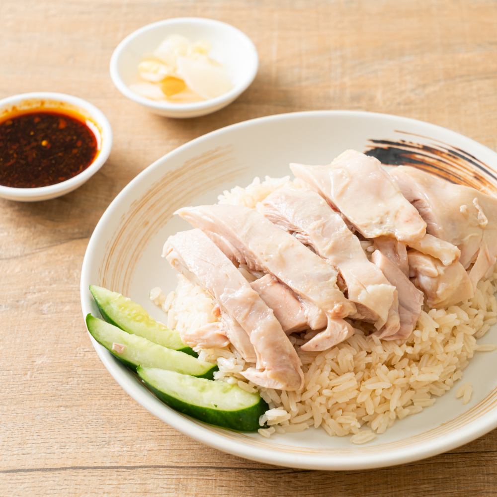 Hainanese chicken rice in a white bowl 