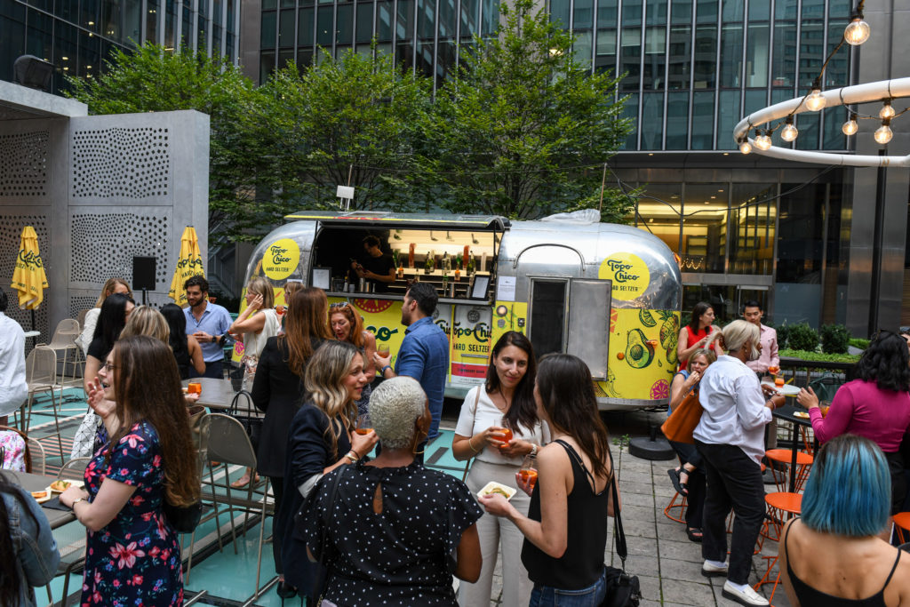 People standing outside a food truck at Chef's Hall during a Canadian Business Summer event
