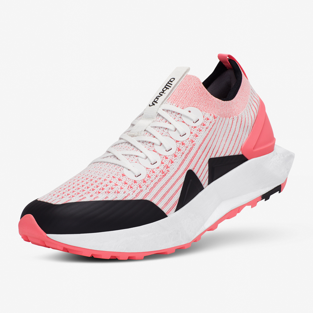 A salmon sneaker with black colour blocking