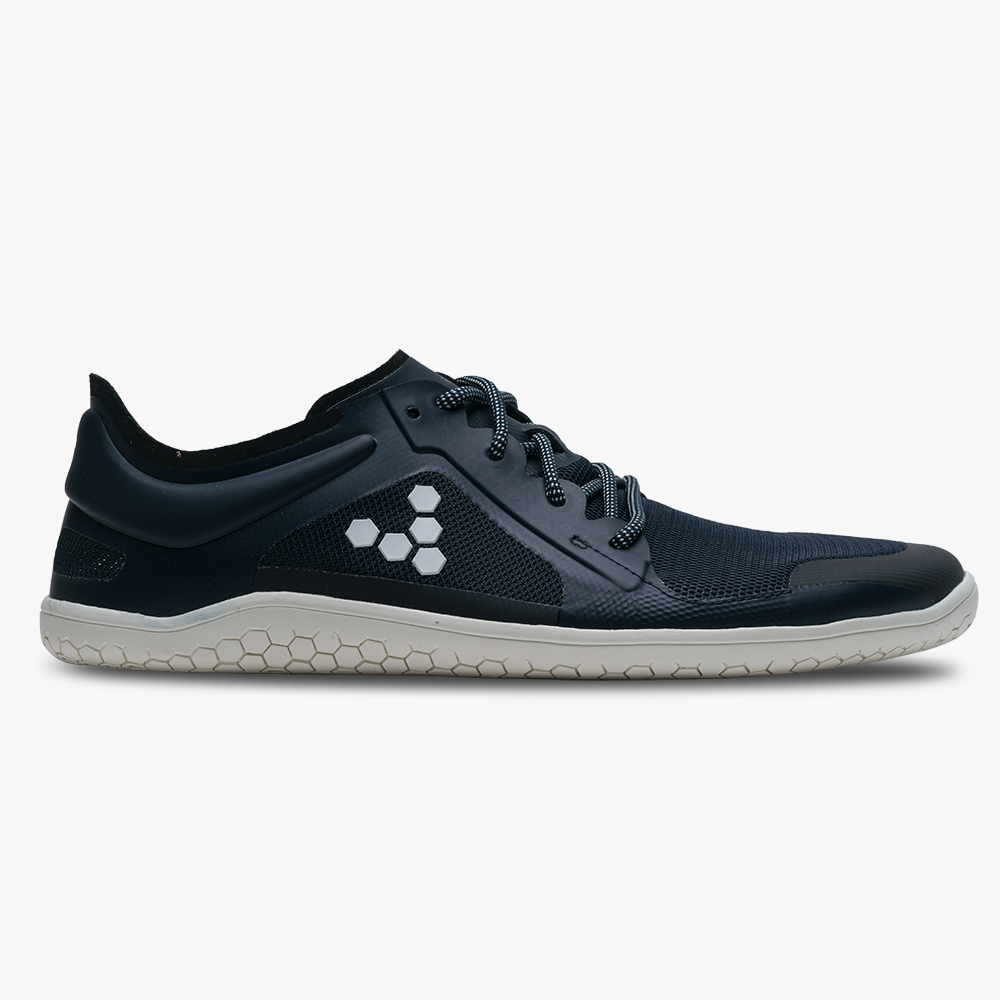 A navy barefoot sneaker with a flat thin sole on a white background