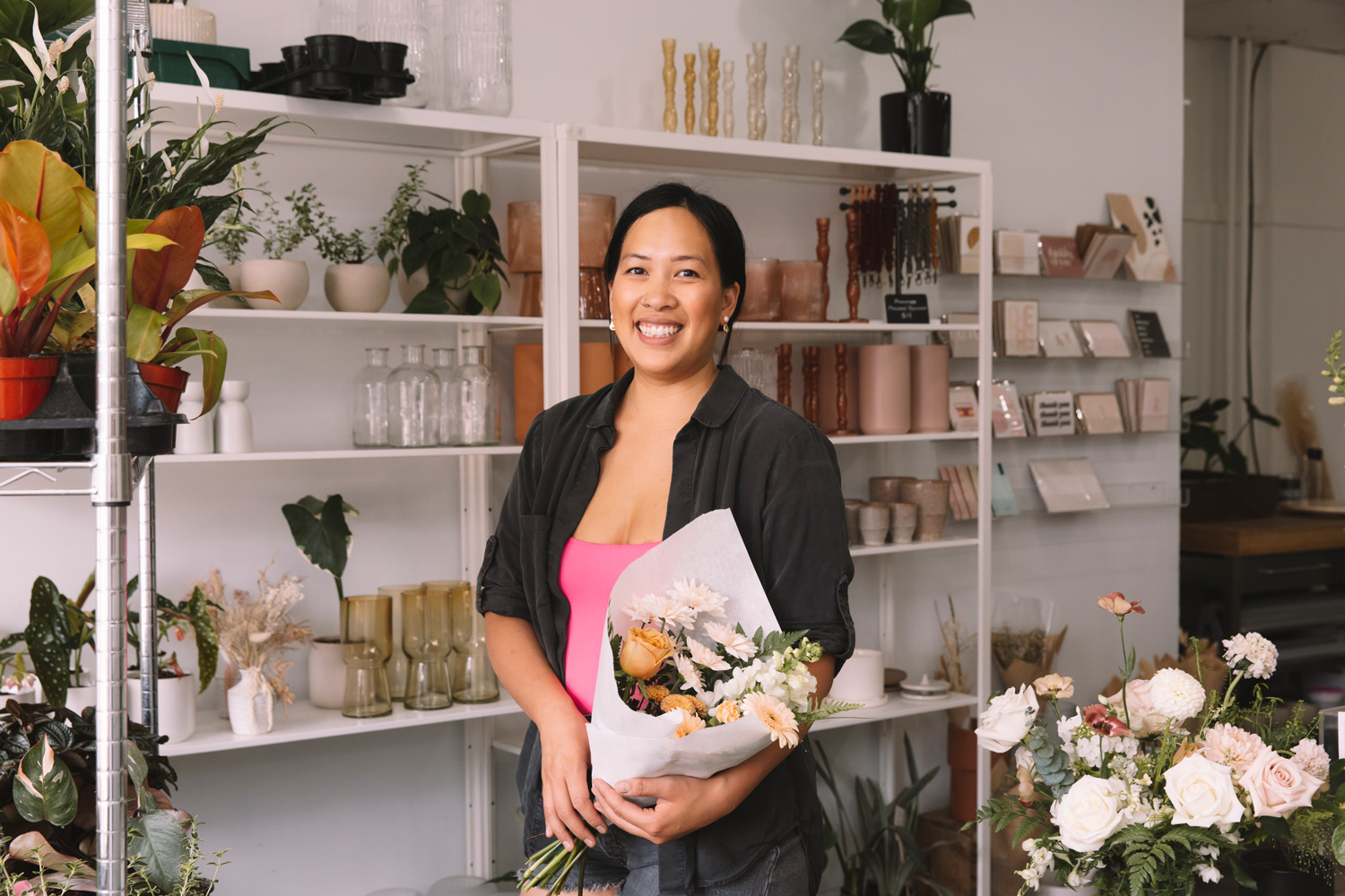 A photo of Annie Tran-Shuttin in her Toronto flower shop, May Flowers