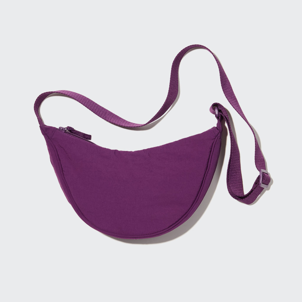 A purple uniqlo crossbody bag shaped like a half moon